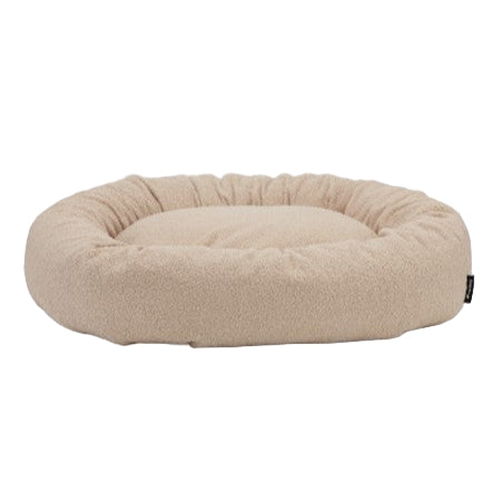 Beige dog bed on a white background
